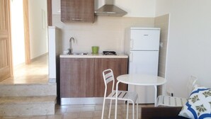 Apartment, 1 Bedroom | Private kitchenette | Fridge, stovetop, cookware/dishes/utensils