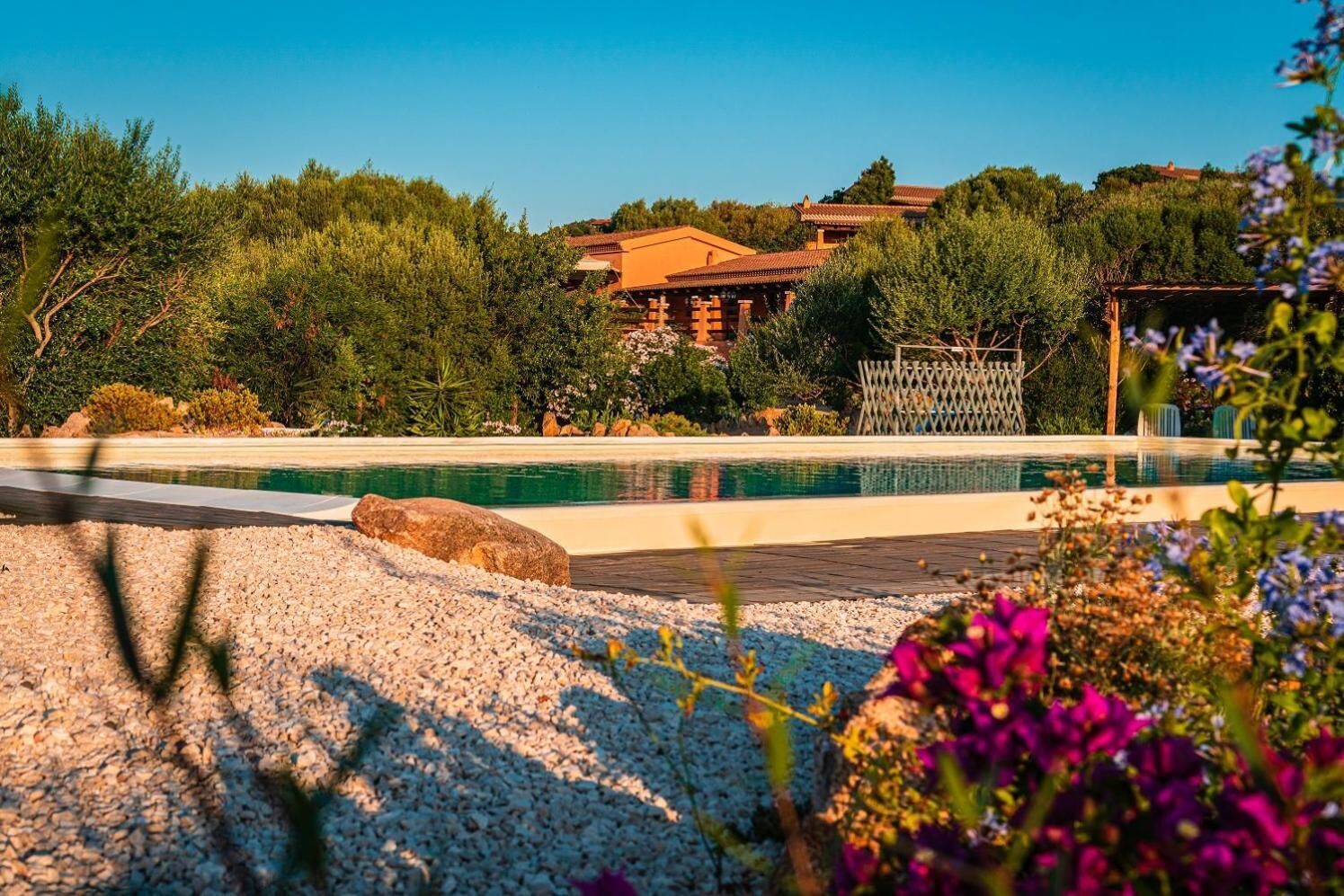 Seasonal outdoor pool, open 7:00 AM to 8:00 PM, pool umbrellas