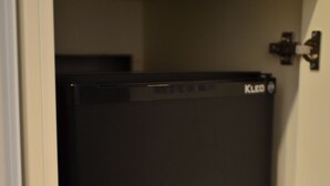 A black refrigerator in a kitchen cabinet. - Stil Suit (Istanbul)