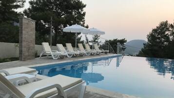 Outdoor pool, pool umbrellas, pool loungers