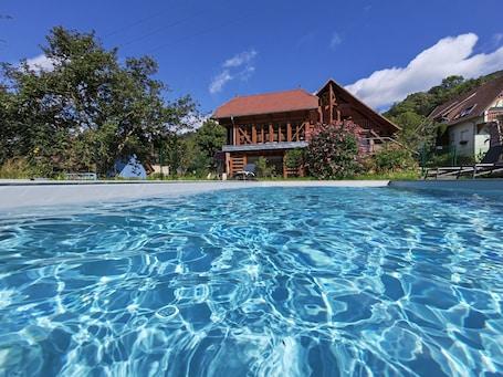Outdoor pool, a heated pool. Maison D'hôtes La Cerisaie