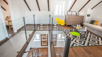 Villa | Living area | 32-inch flat-screen TV with satellite channels, TV, books