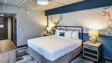 Premium bedding, desk, laptop workspace, blackout drapes