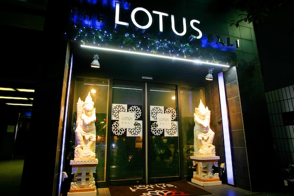 The exterior of a building with a sign that reads "LOTUS." - Hotel The Lotus Bali - Adult Only (Kawasaki)