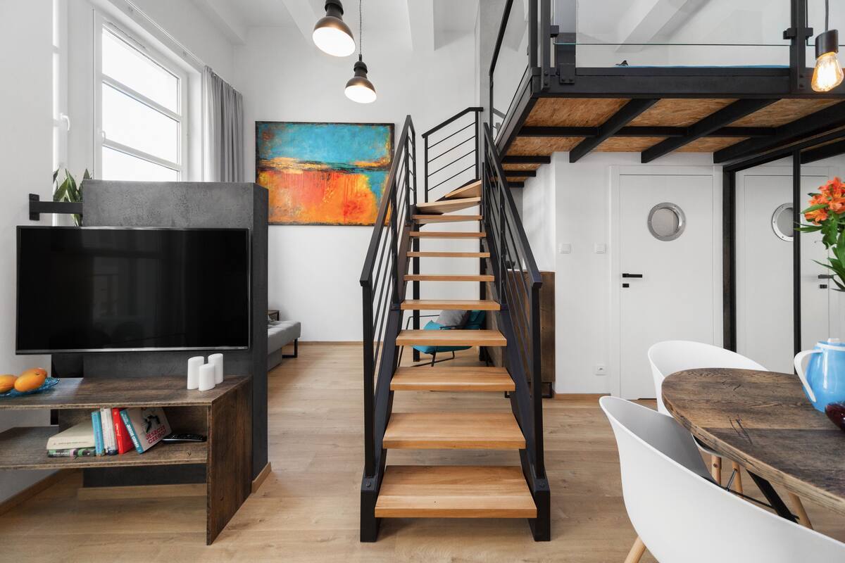 Exclusive Loft, Multiple Beds | Living room