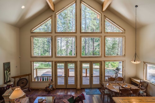 Riverfront cabin with a hot tub & fireplace.