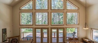 Riverfront cabin with a hot tub & fireplace.