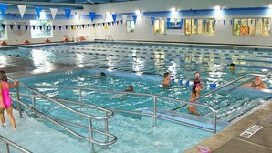 An indoor swimming pool with multiple lanes, a lifeguard chair, and a 'NO DIVING' sign. - 401 Dog-Friendly - minutes to Beach Access & YMCA (Nags Head)