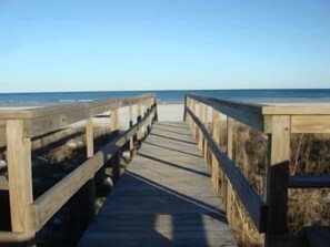 A wooden boardwalk leading to the beach. - Beachfront Condo, Vibrant, Family-Friendly (St Augustine)