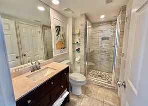 Shower, towels, soap, toilet paper