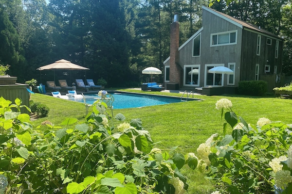 Modern heated S/W pool surrounded by nature
