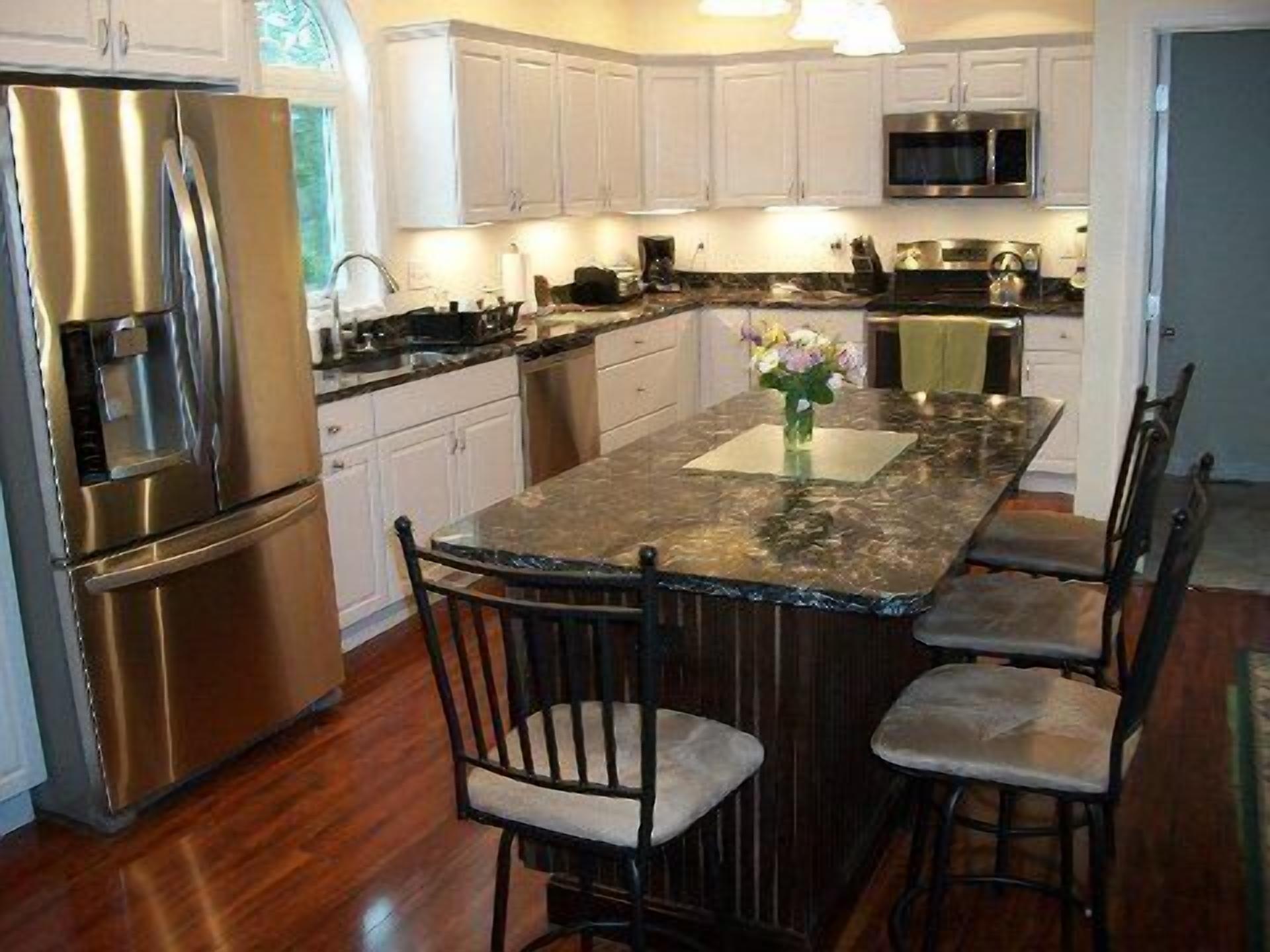 Fridge, microwave, oven, stovetop view of vacation home property