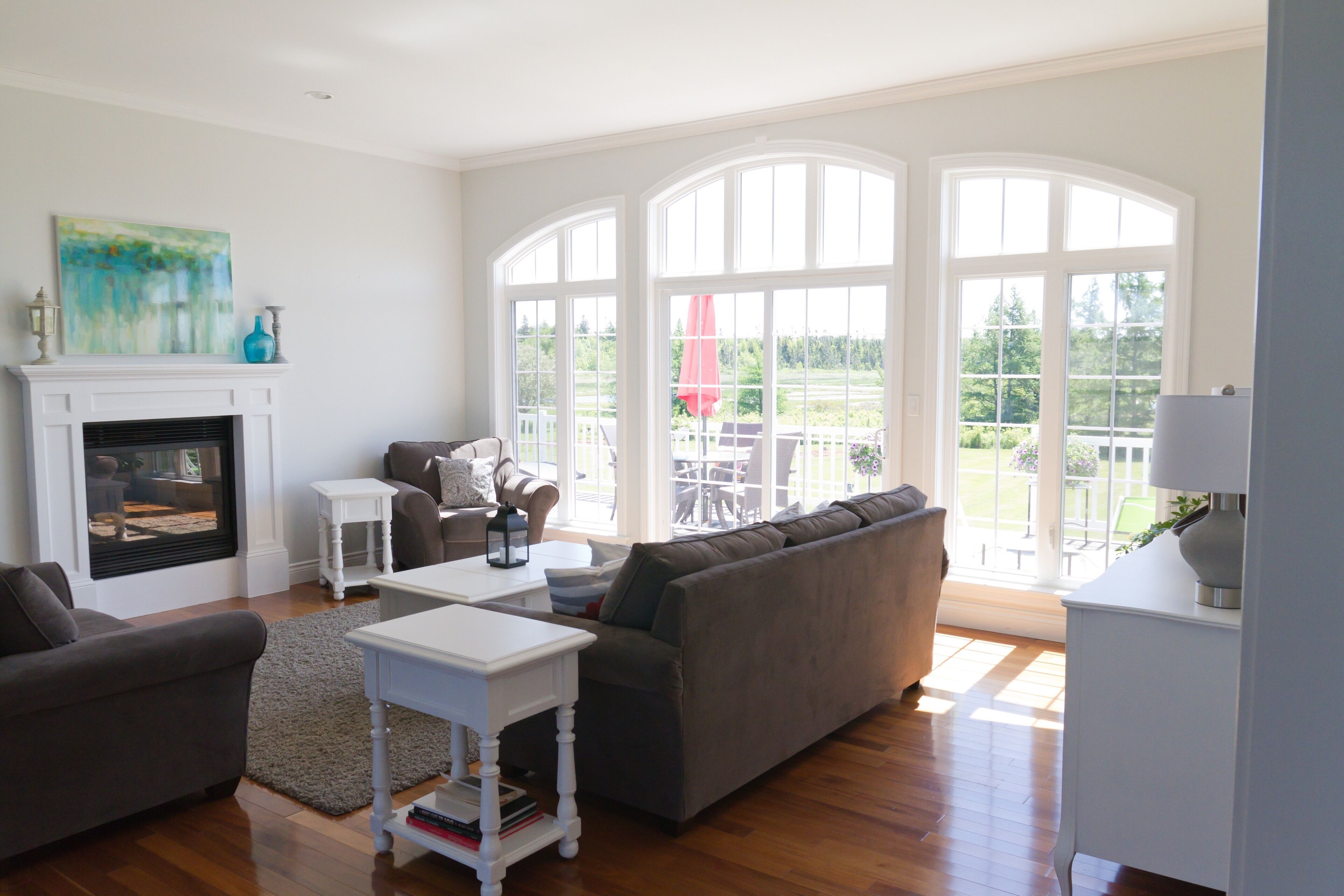 Smart TV, fireplace, books, stereo view of vacation home property