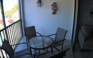 Outdoor dining - Waterfront 1BR condo with pool, WiFi, kitchen, and Marco Island access. (Marco Island)