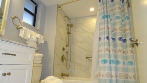 Bathtub, hair dryer, towels