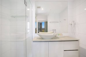 Shower, hair dryer, towels, shampoo