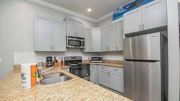 Coffee/tea maker, fridge, microwave, oven