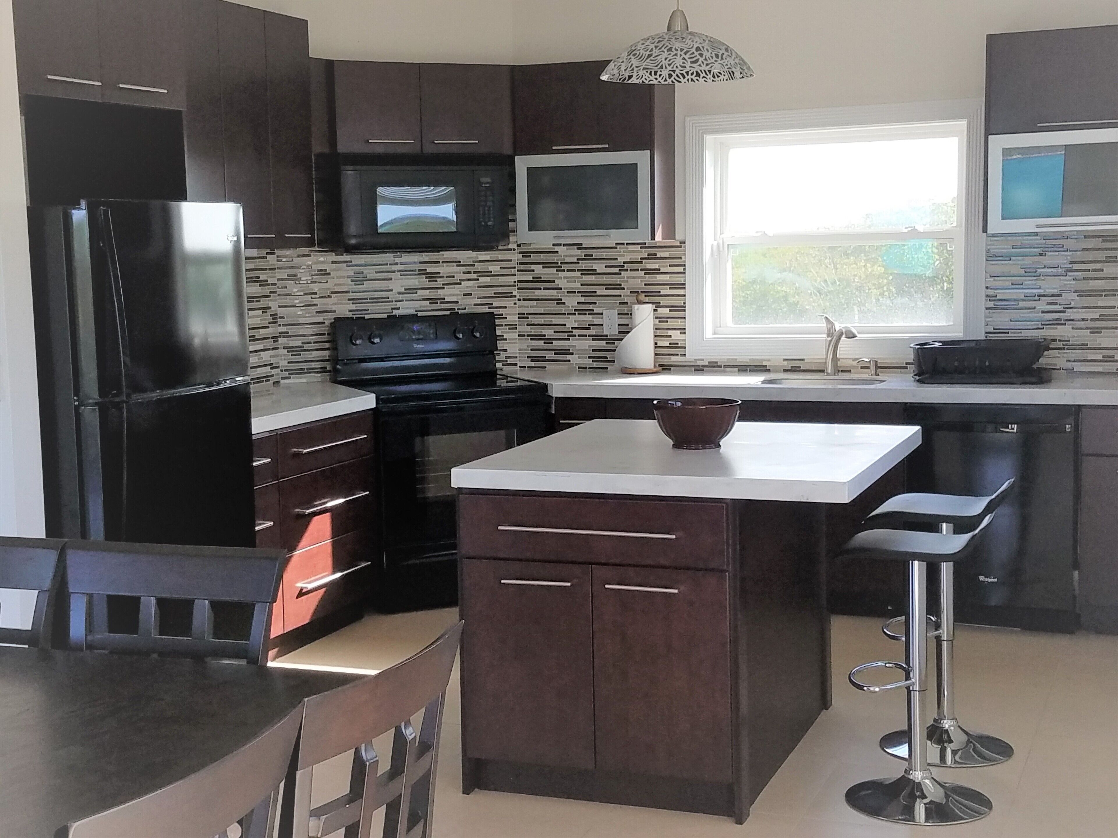 Coffee/tea maker, fridge, microwave, oven