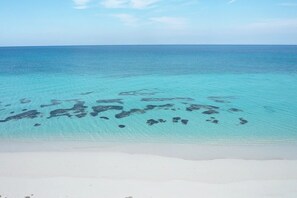 On the beach, sun loungers, beach towels