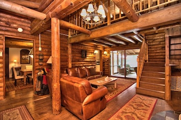 Rustic Log Cabin Entrance -- cozy up to the wood burning fireplace.