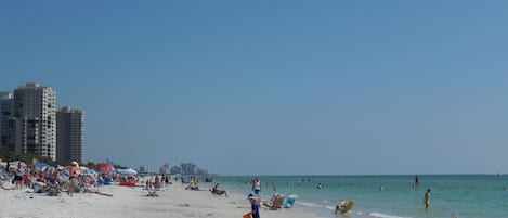 On the beach, sun-loungers, beach towels