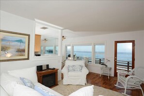 Living room of beach cottage with hardwood floors throughout