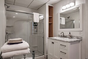 Combined shower/tub, hair dryer, towels, soap