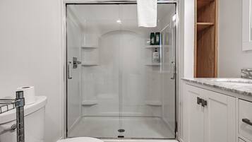 Combined shower/tub, hair dryer, towels, soap