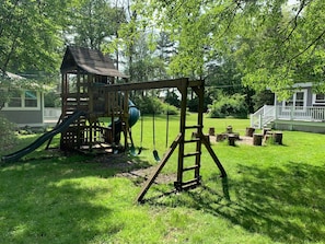 Wooden Play Set with 3 swings, climbing wall and slide