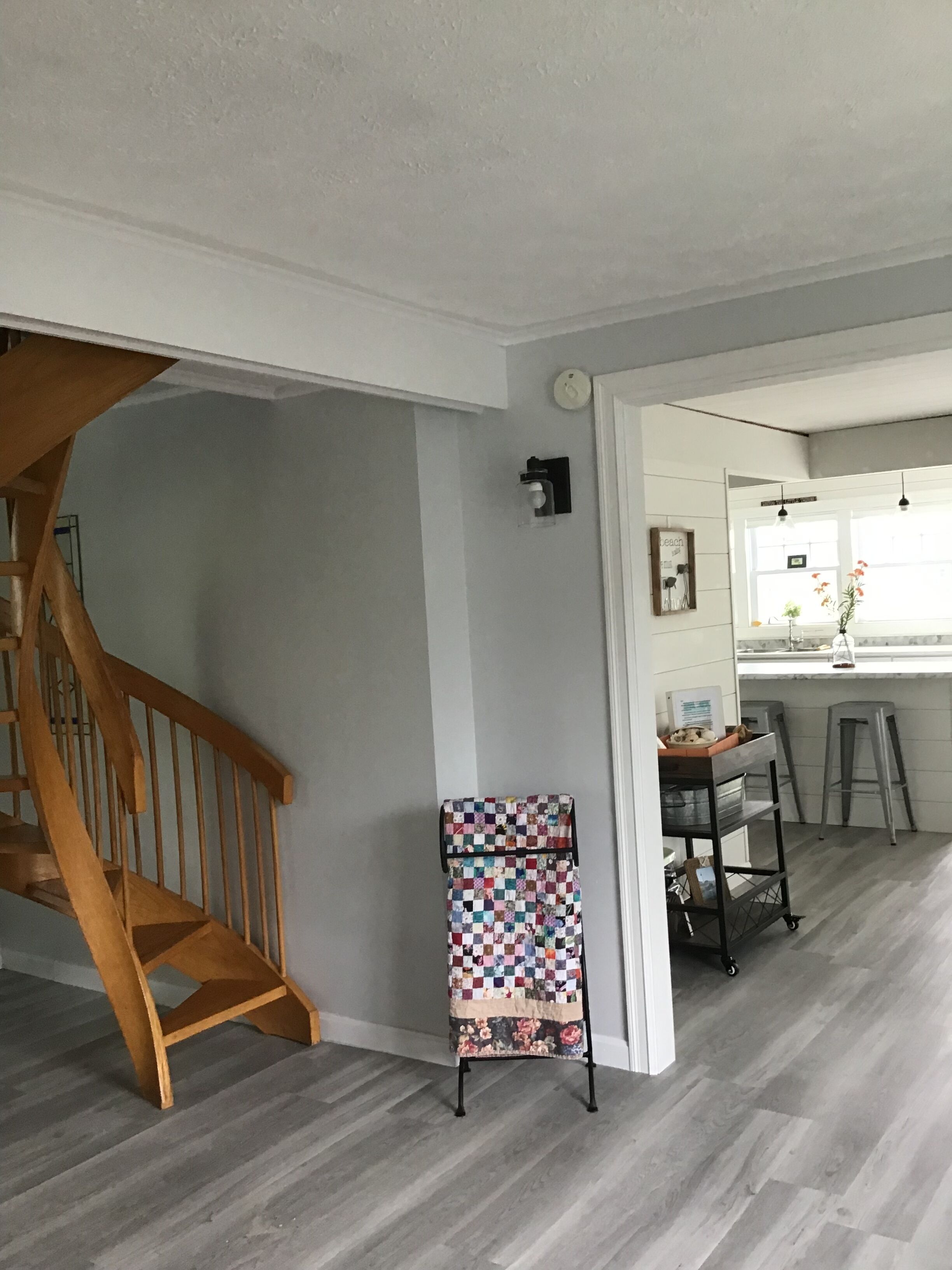 Spiral staircase to comfortable bedroom with two twin beds