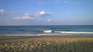 Enjoy a serene beach experience with gentle waves and soft sand.