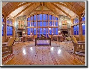 A spacious room with a high ceiling, wooden flooring, and large windows. - 🎿 Ski-In\Out Penthouse. Sunrise 🌅 Mtn ⛰️ Views. Snowshoe’s Most Luxurious Lodge 🌅 (Snowshoe)
