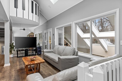 Modern Creek-front House with Volleyball court in the backyard.