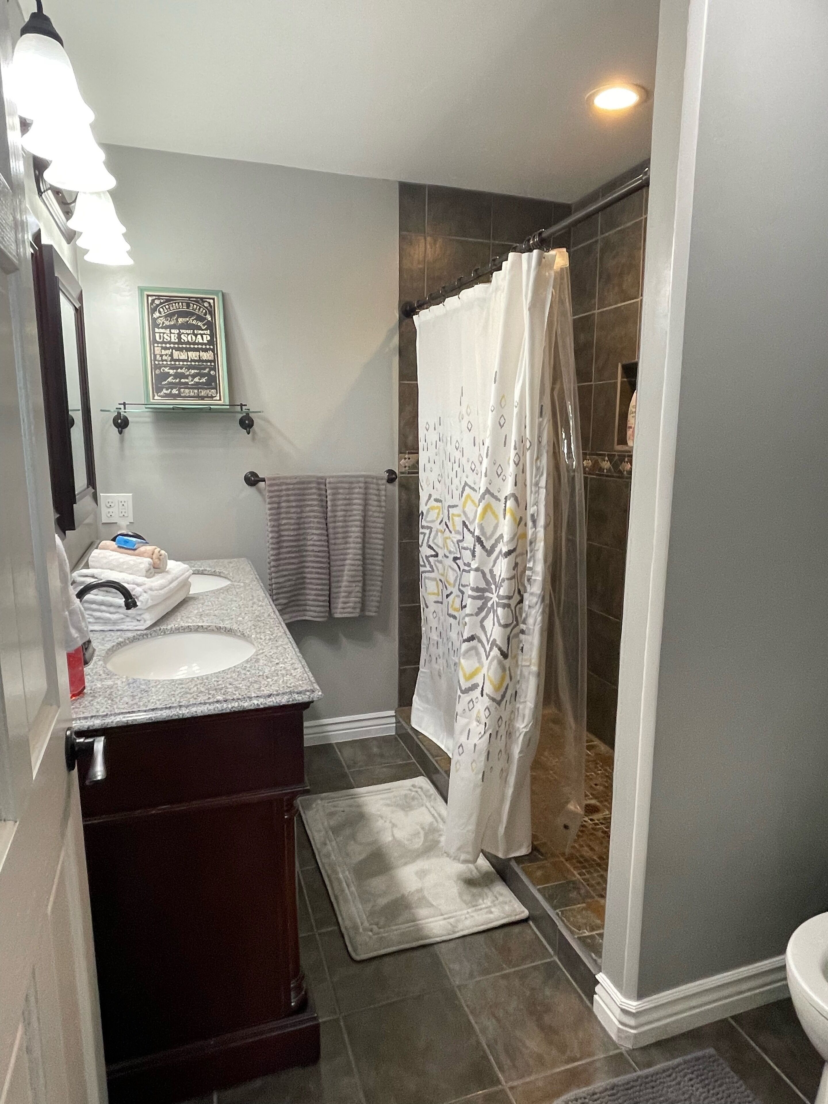 Combined shower/tub, hair dryer, towels, soap