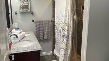 Combined shower/tub, hair dryer, towels, soap