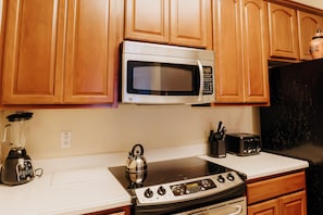 Enjoy cooking in this well-equipped kitchen with a microwave, induction cooktop, kettle, and toaster.