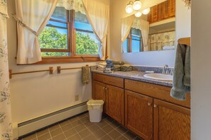 Combined shower/bathtub, hair dryer, towels, soap