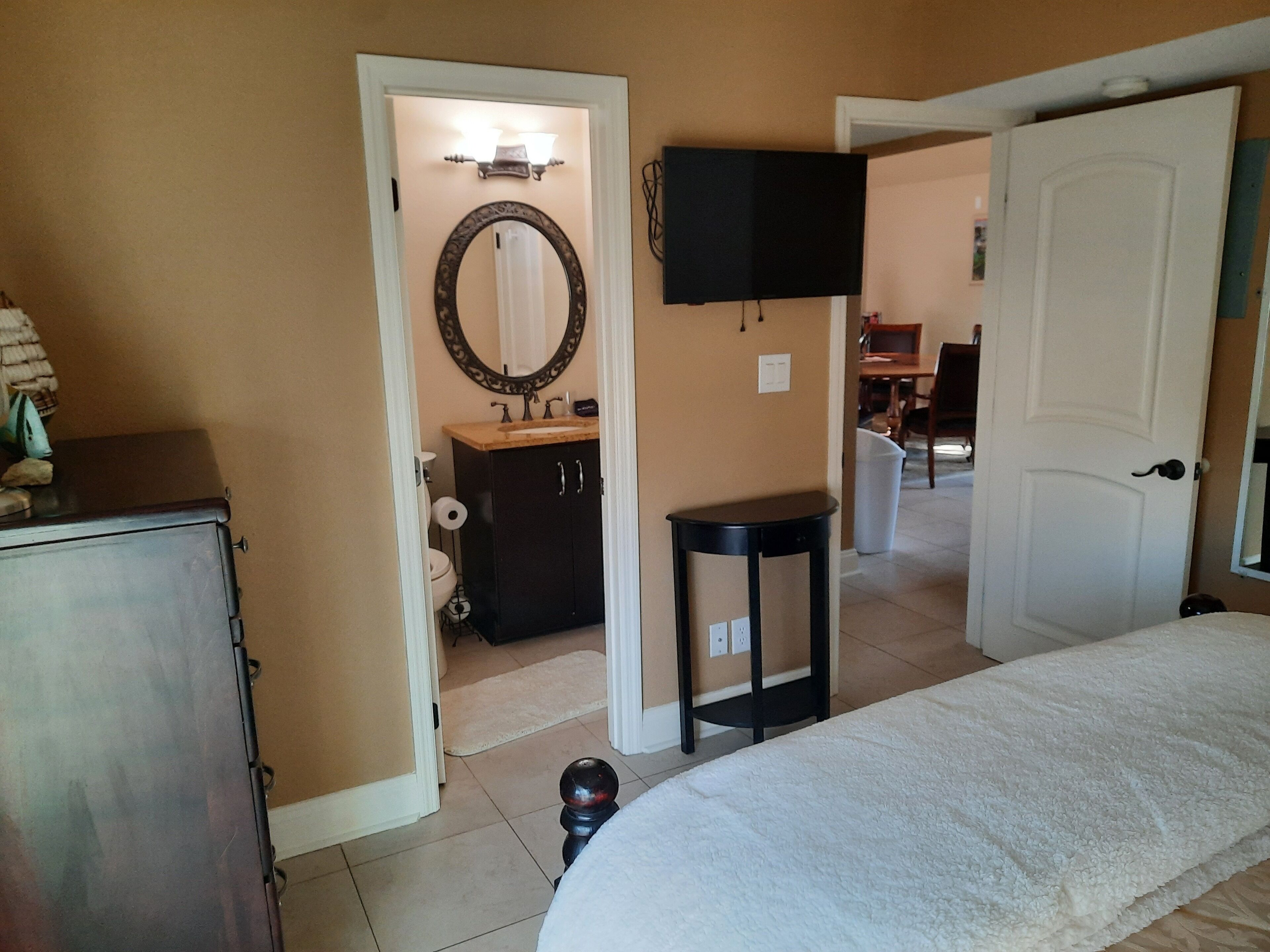 downstairs queen w/ private full bath & entry to back deck