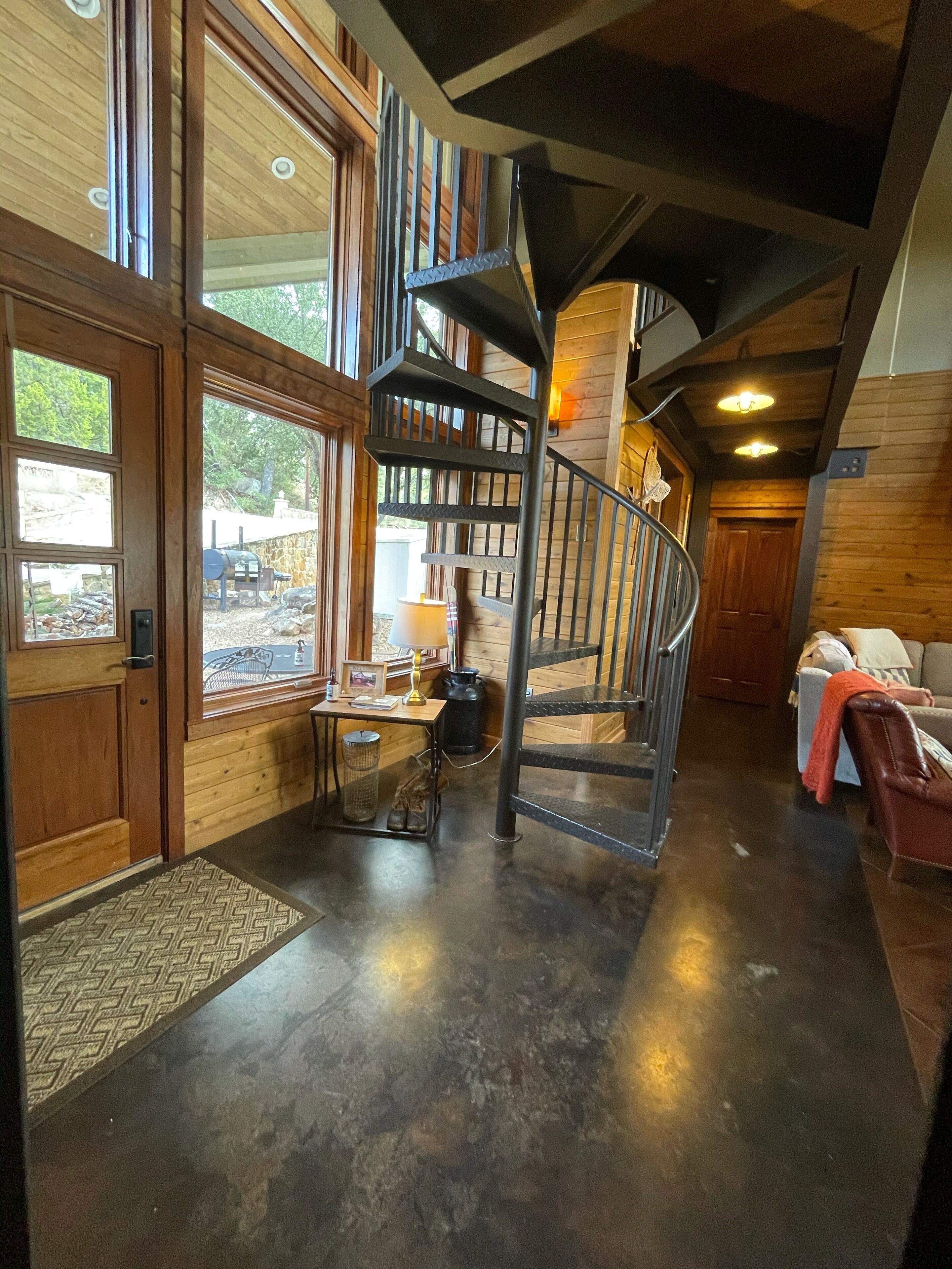 Downstairs entry with custom spiral staircase