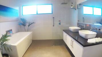 Bathtub, hair dryer, towels, soap