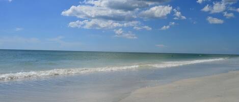 On the beach, sun-loungers, beach towels