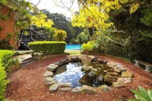 Property grounds - PERFECT FOR LARGE FAMILIES CLOSE TO BEACH AND SHOPS, ACREAGE & GAMES ROOMS (Coffs Harbour)