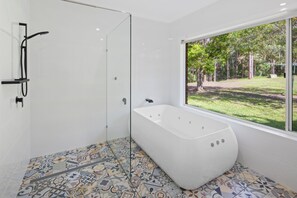 Bathtub, jetted tub, hair dryer, towels