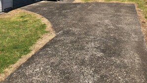 A residential property with a garage, a covered patio, and a well-maintained lawn. - Serenity - our home away from home (Whitianga)