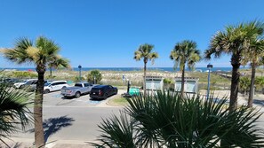Park your vehicle in designated spaces, including a handicapped spot, near the beachfront.