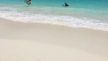 On the beach, sun loungers, beach towels