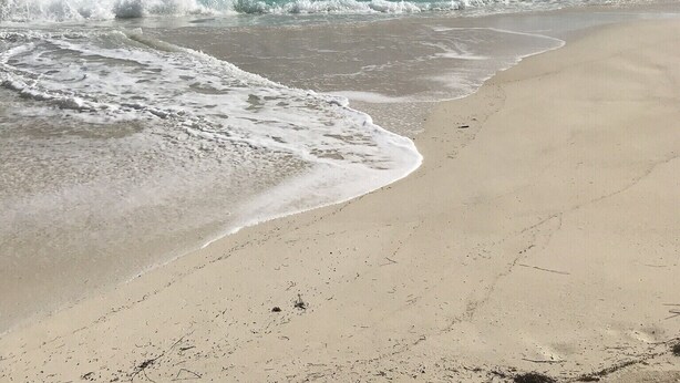 A beach with clear turquoise water, gentle waves, and a wide sandy shore under a partly cloudy sky. - Aqua Dreams, Htd Priv Salt Pool, At Beach, Guest hse, 4 Kng BRs for 12, Lg Spa!! (Georgetown)