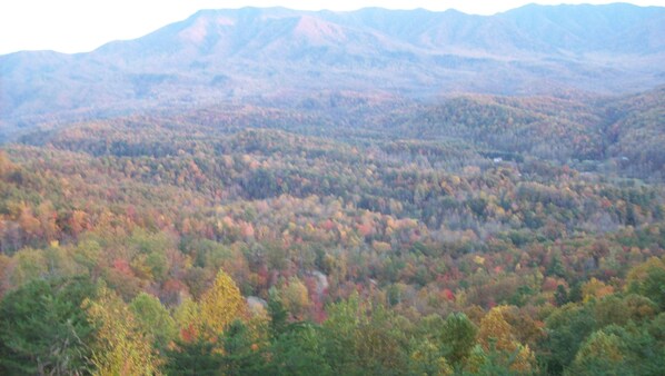 A mountainous landscape with autumn foliage.