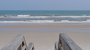 A beach with wooden barriers and a clear view of the ocean. - Flip Flops - Cozy 2nd Row Home - Ocean Views! (Surf City)