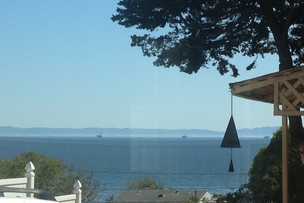 View from living room, kitchen and dining area. Nice Ocean Breeze.